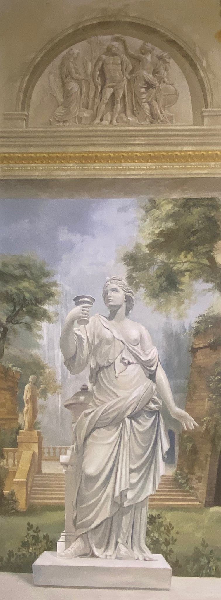 Trompe l'oeil entry mural of a classical statue in a garden with grisaille lunette above by Kim Delaney, Delaney Fine Finishes