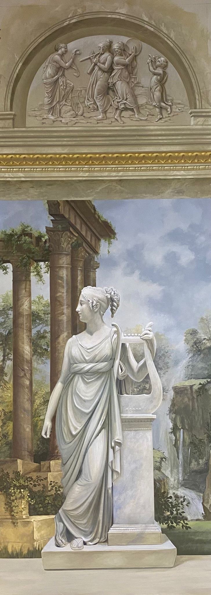 Trompe l'oeil entry mural of a classical statue among painted ruins by Kim Delaney, Delaney Fine Finishes