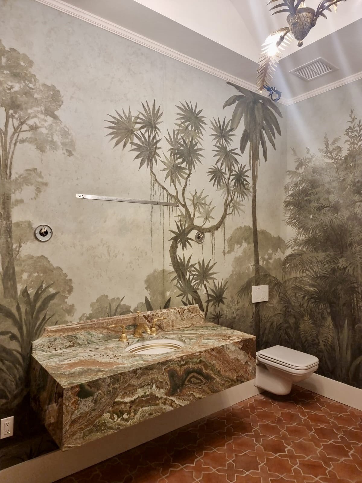 Hand-painted jungle mural powder room with marble vanity by Kim Delaney, Delaney Fine Finishes
