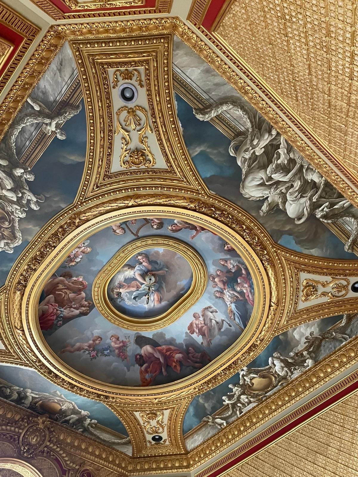 Coffered ceiling with hand-painted oval fresco of classical figures and gilded frames by Kim Delaney, Delaney Fine Finishes