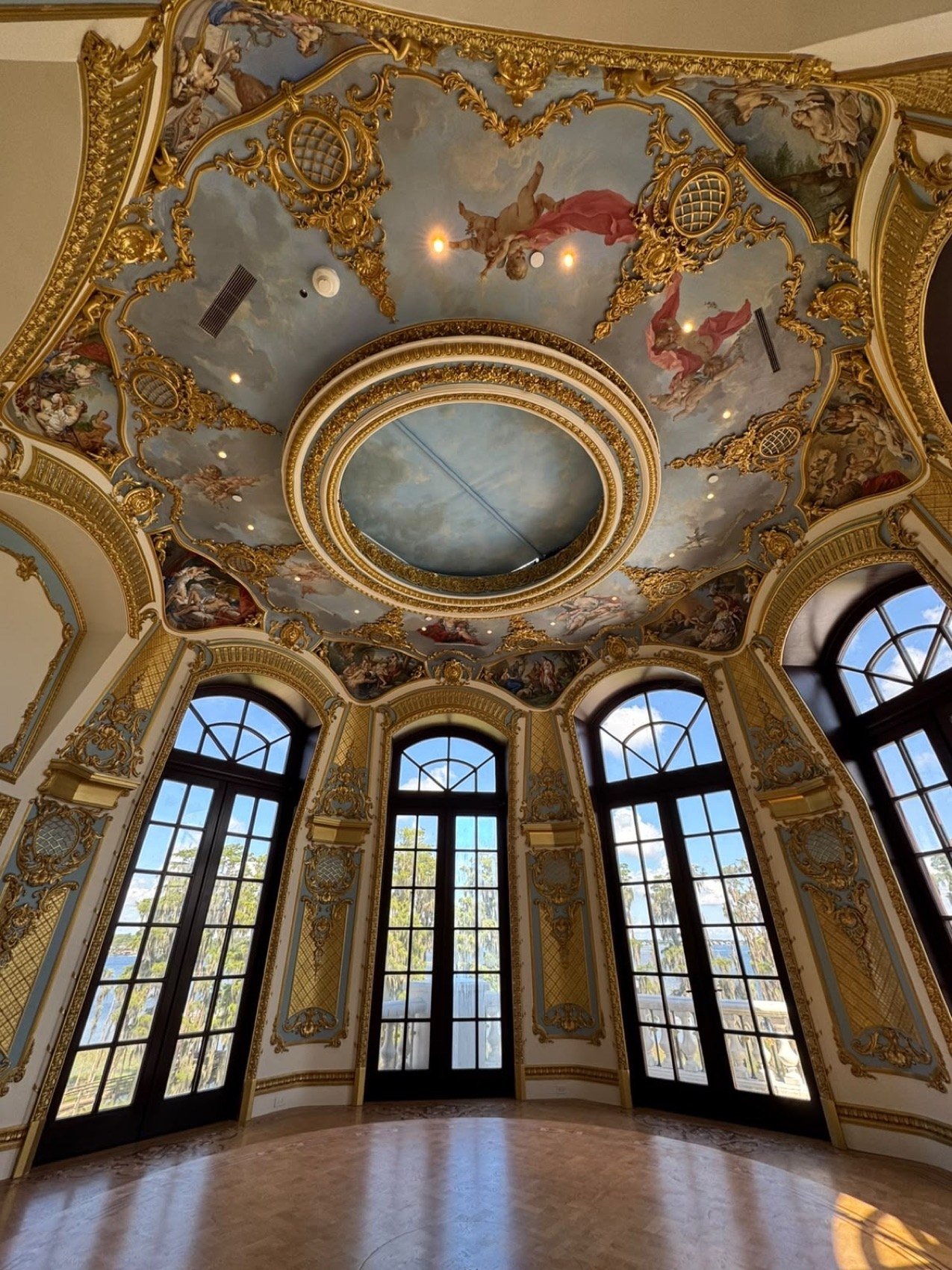 Master sitting room with domed ceiling frescoes, gilded boiserie and arched French doors by Kim Delaney, Delaney Fine Finishes
