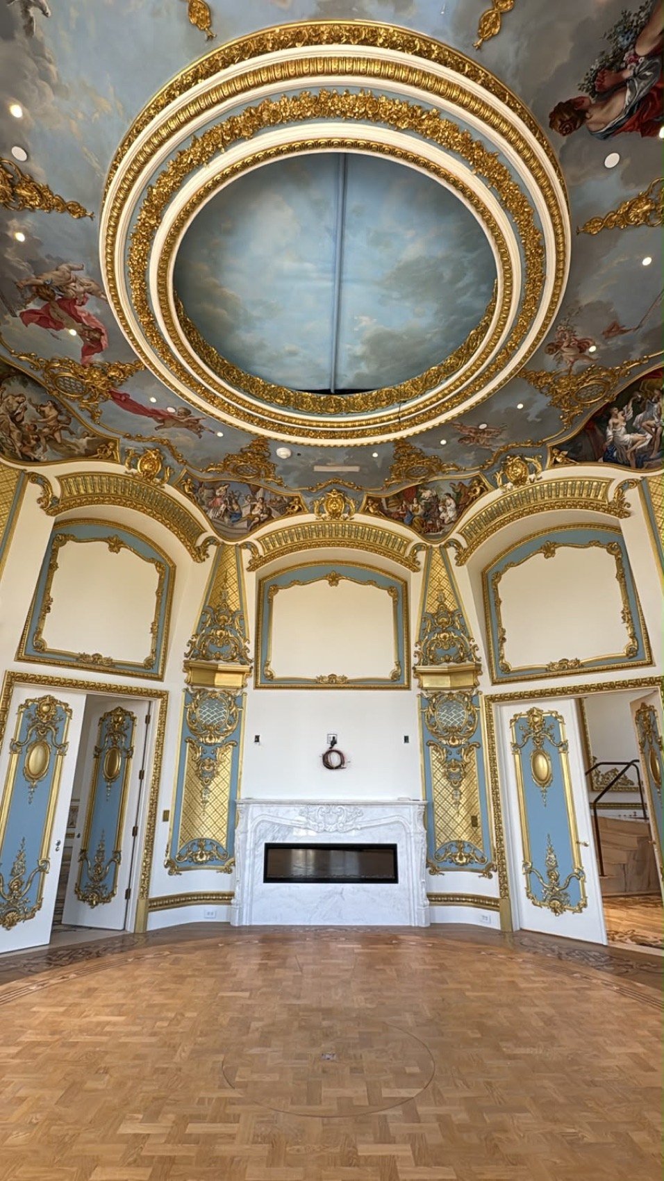 Master sitting room fireplace wall beneath a hand-painted domed ceiling by Kim Delaney, Delaney Fine Finishes