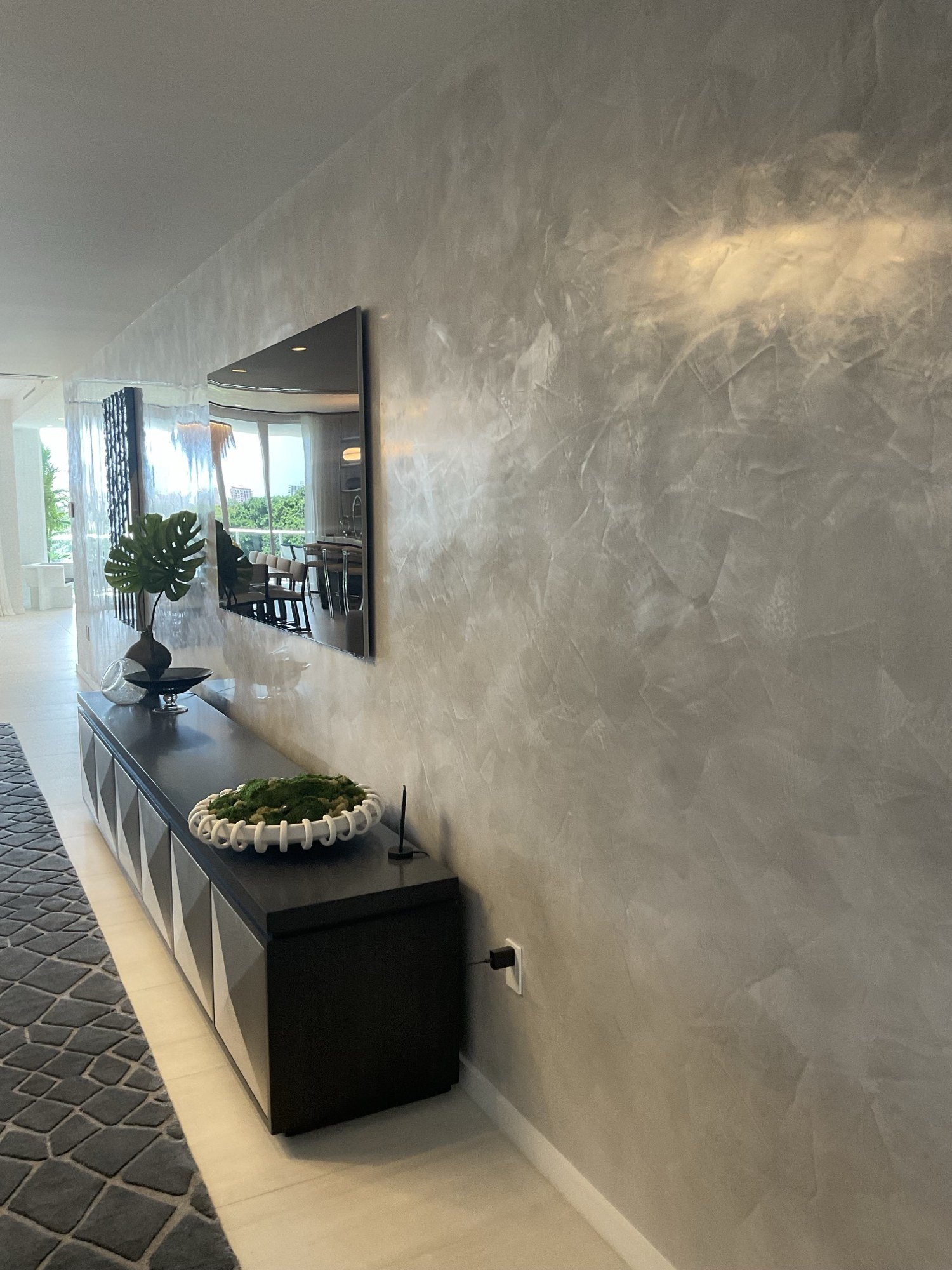 Silver-gray polished Venetian plaster feature wall by Kim Delaney, Delaney Fine Finishes