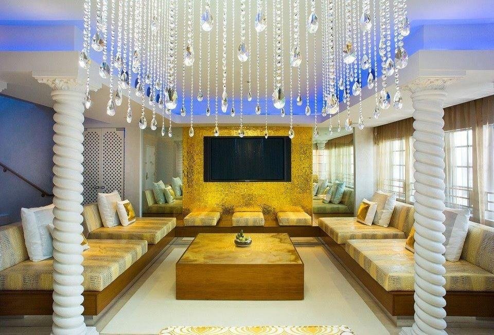 Lounge with sculpted spiral plaster columns and gilded mosaic wall by Kim Delaney, Delaney Fine Finishes