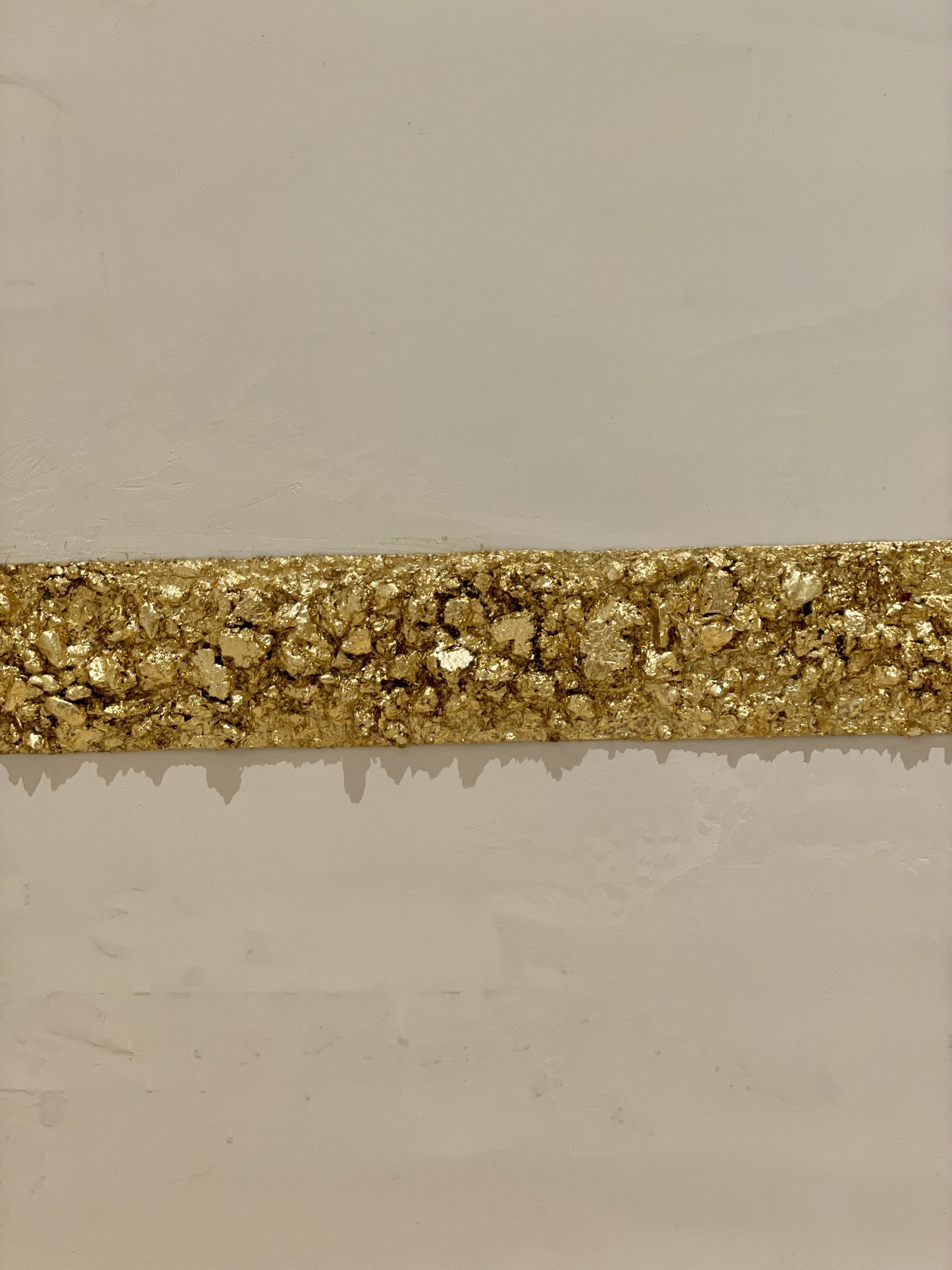 Gold-leaf inlay band set into smooth plaster, detail, by Kim Delaney, Delaney Fine Finishes